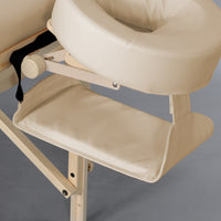 Repose-mains beige suspendu sous la têtière de la table de massage femme enceinte Jeanne